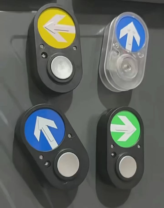 Four Australian pedestrian crossing light magnets with colorful arrow signals in yellow, green, and blue, featuring black and clear cases with realistic push button designs on a white background.
